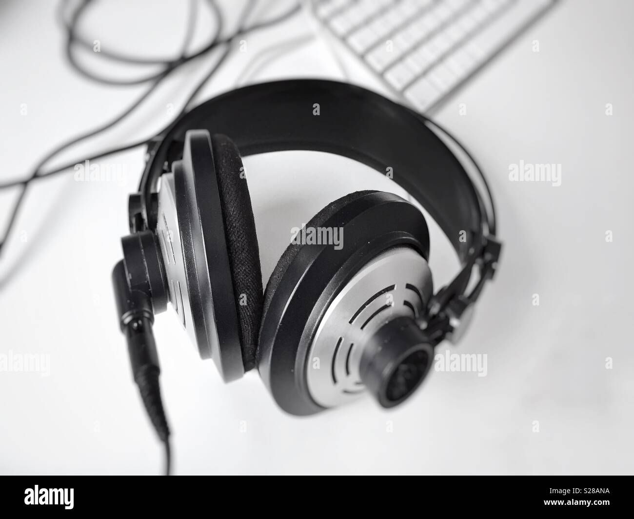 Black and white professional headphones. Selective focus. Music and relaxation concept - Smartphone Captured Stock Image