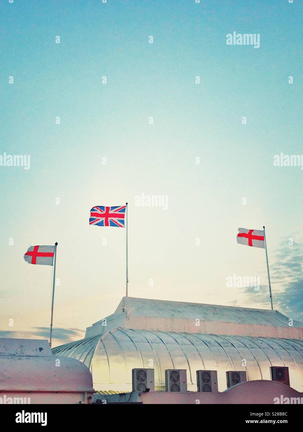 Flags flying on top of the pier at Burnham on Sea, Somerset - Smartphone Captured Stock Image