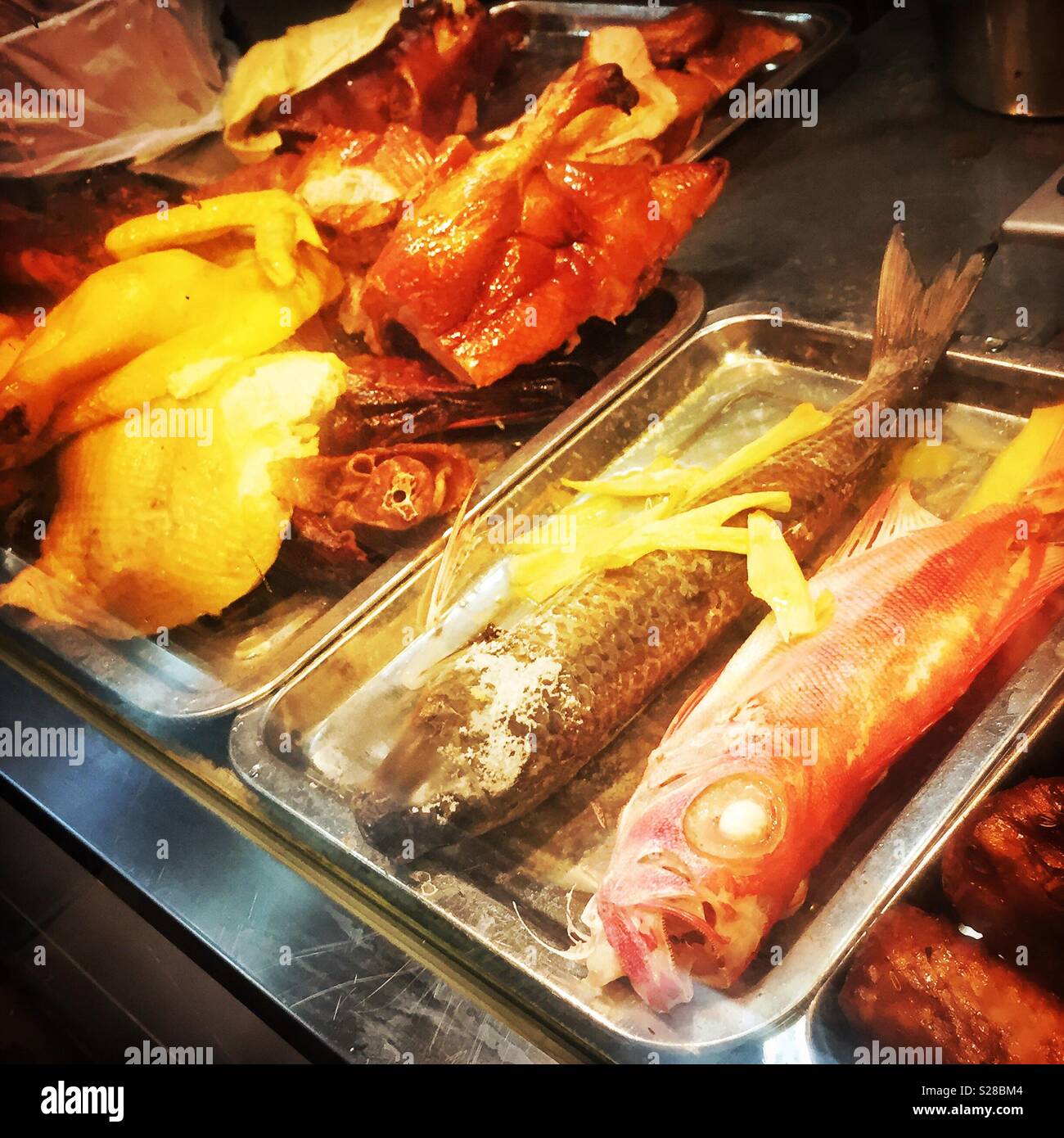 Chicken and fish on display in a restaurant in Sheung Wan, Hong Kong ...
