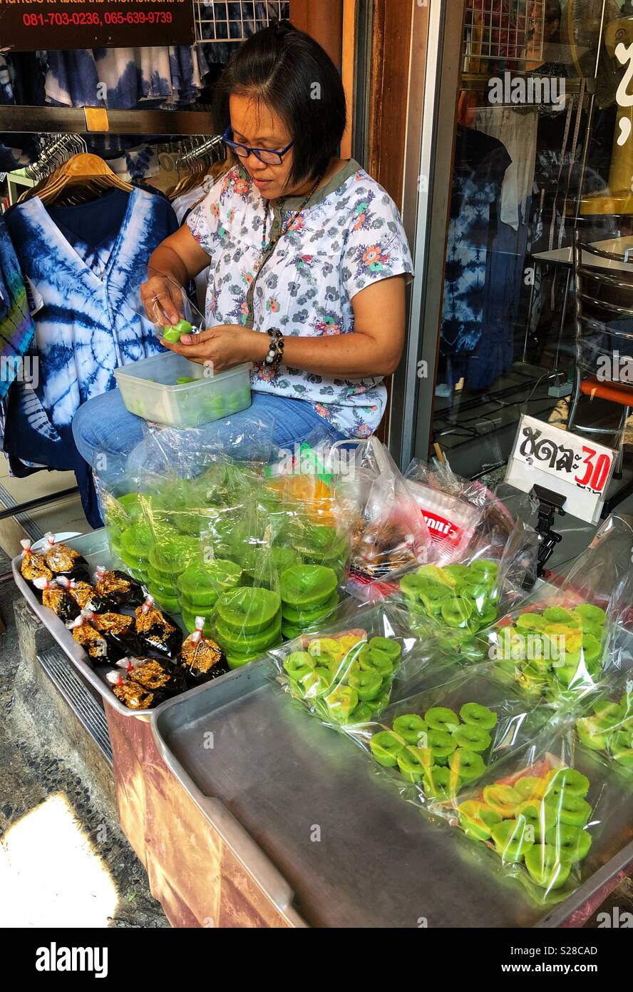 A street vendor at an outdoor market in Bangkok, Thailand. - Smartphone Captured Stock Image