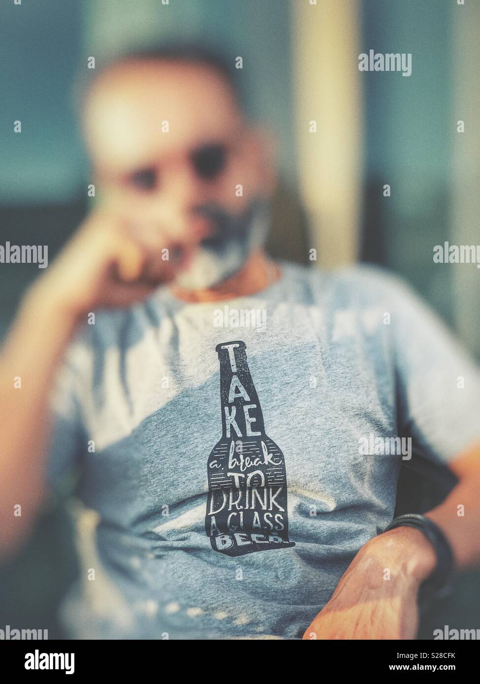 Man with a beer shirt Stock Photo