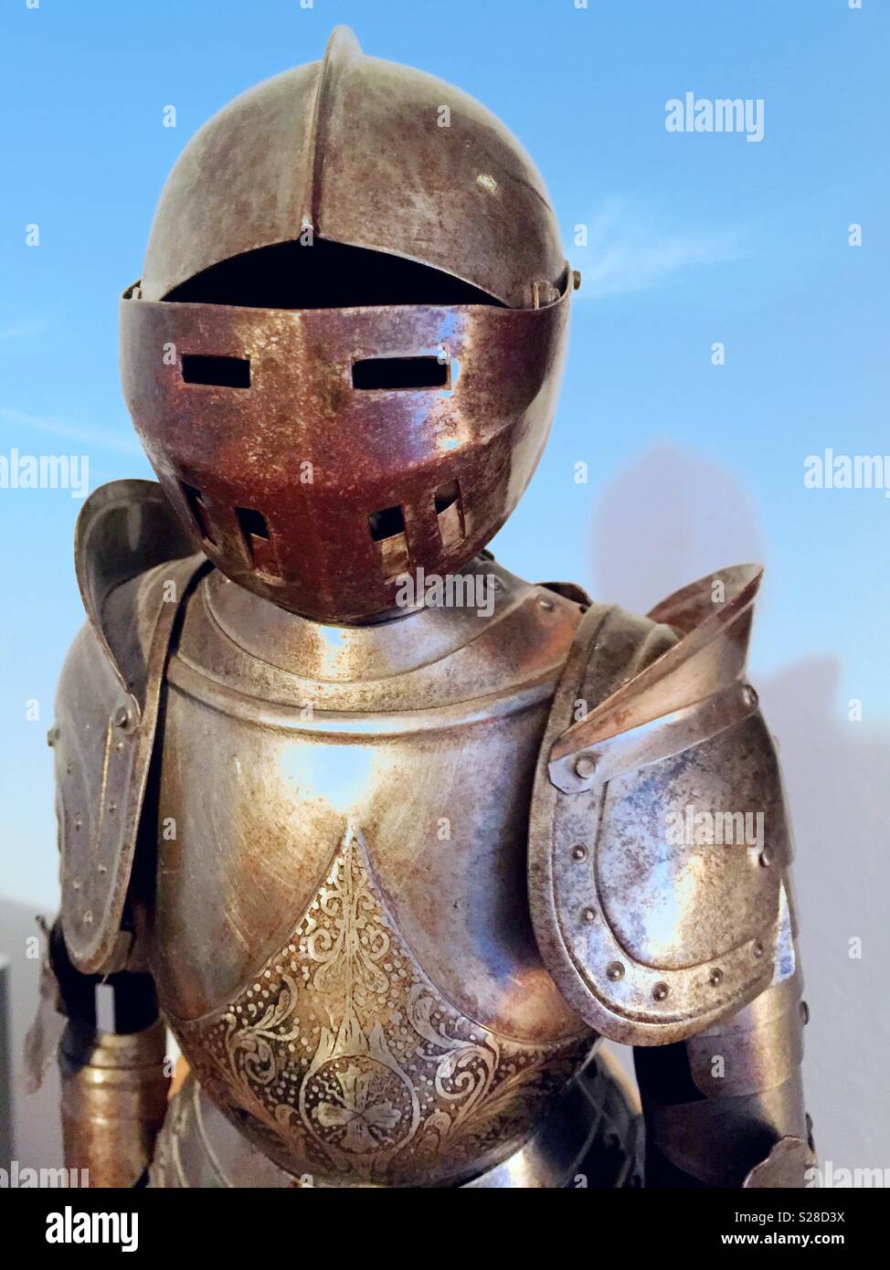 Antique miniature suit of armor statue. - Smartphone Captured Stock Image