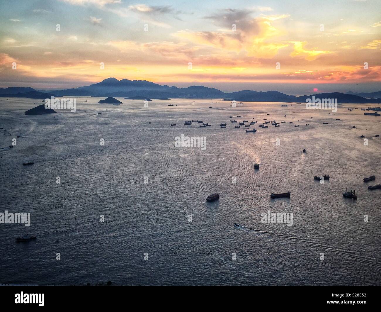 Victoria Harbour and (L to R) Green Island, Middle Island, Peng Chau and Lantau Island from level 85 of the ICC, Hong Kong's tallest building - Smartphone Captured Stock Image