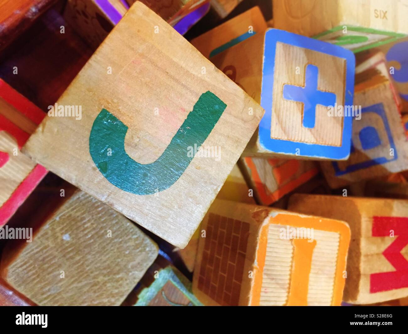 Jumble of wooden children’s blocks, close up, USA - Smartphone Captured Stock Image