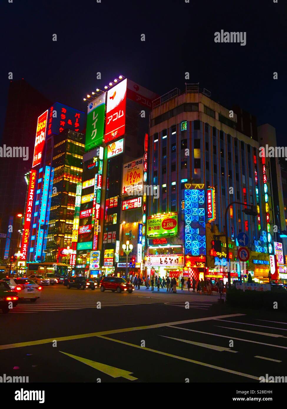 Night view of buildings with bright neon lights in a big city Stock Photo