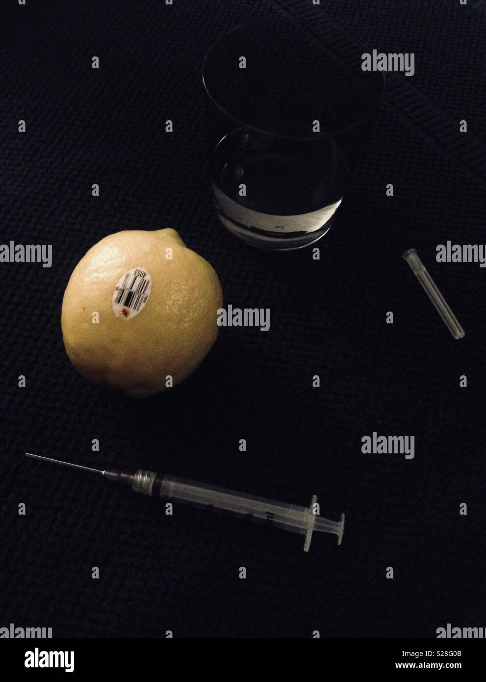 Practicing on a lemon to give my wife her first IVF trigger shot