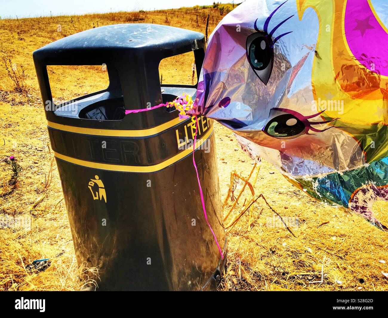 Children’s helium filled bloom attached to a litter bin - Smartphone Captured Stock Image