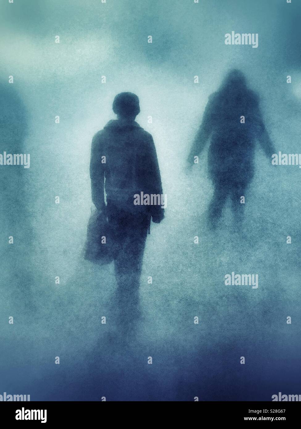 Figures in the fog Stock Photo