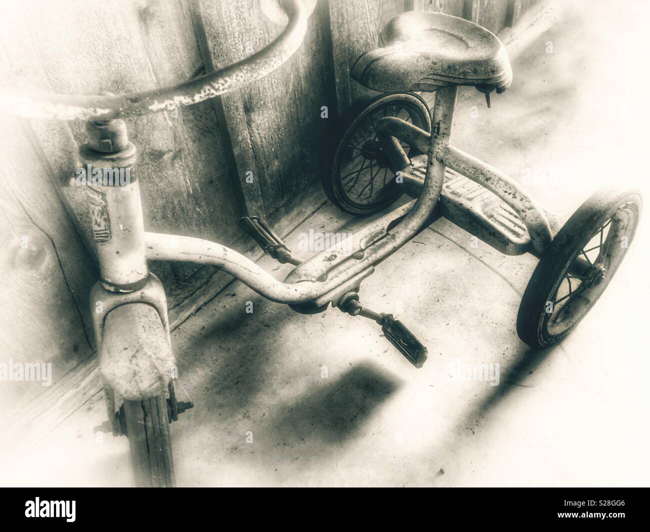 Vintage tricycle in sepia tone - Smartphone Captured Stock Image