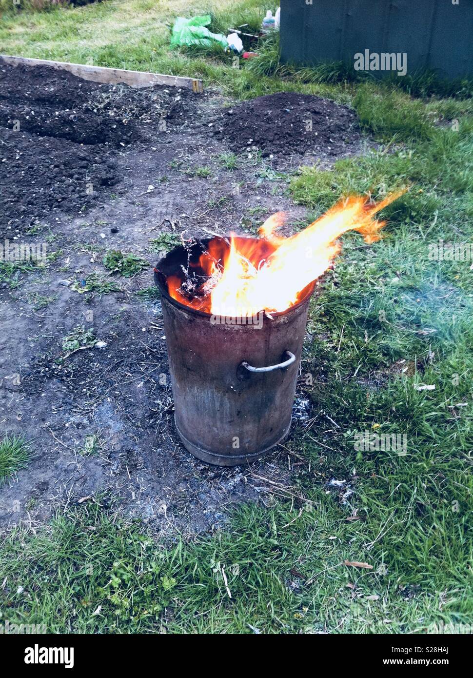Burning bin incinerator fire Stock Photo - Alamy