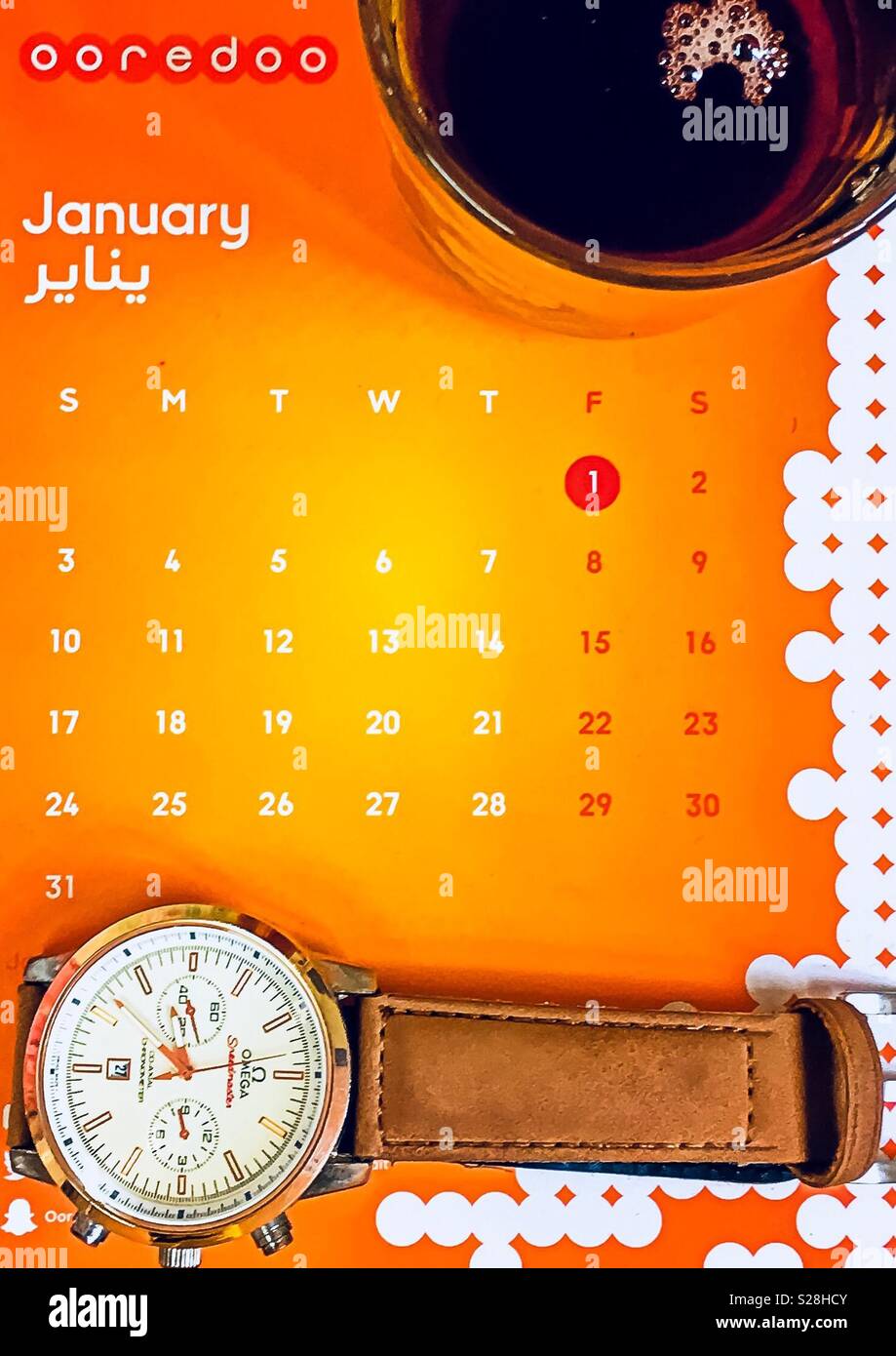 Nice picture contains a cup of tea, calendar, and watch Stock Photo