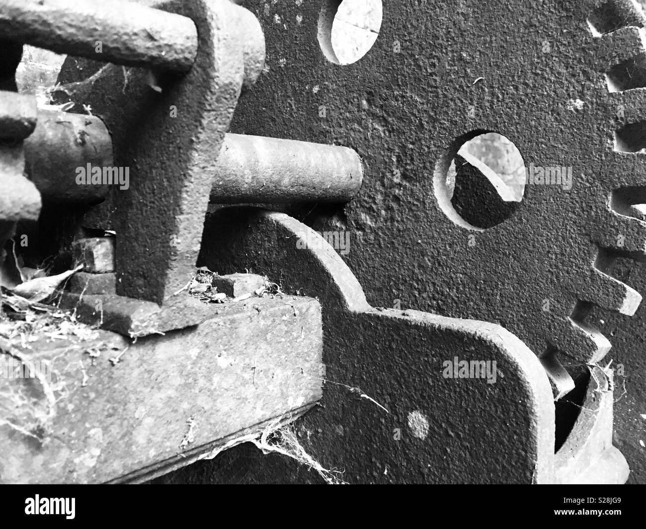 Cogs and mechanical parts of the metal machinery used to move sluice gates, Stock Photo