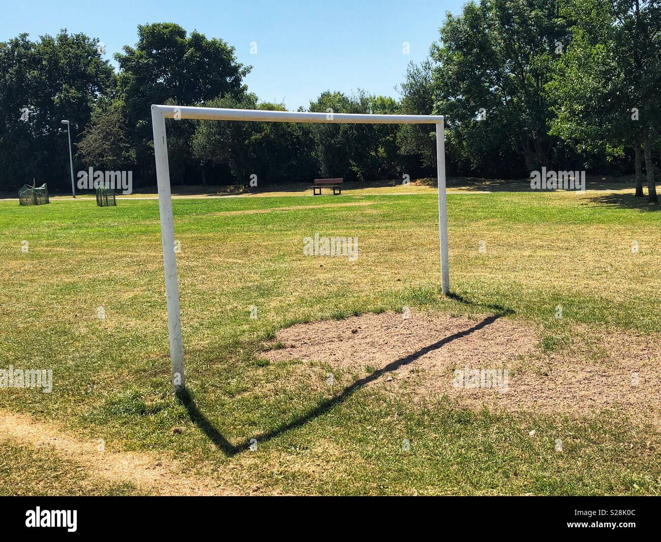 White football goals on a football pitch in a public park, Greasby