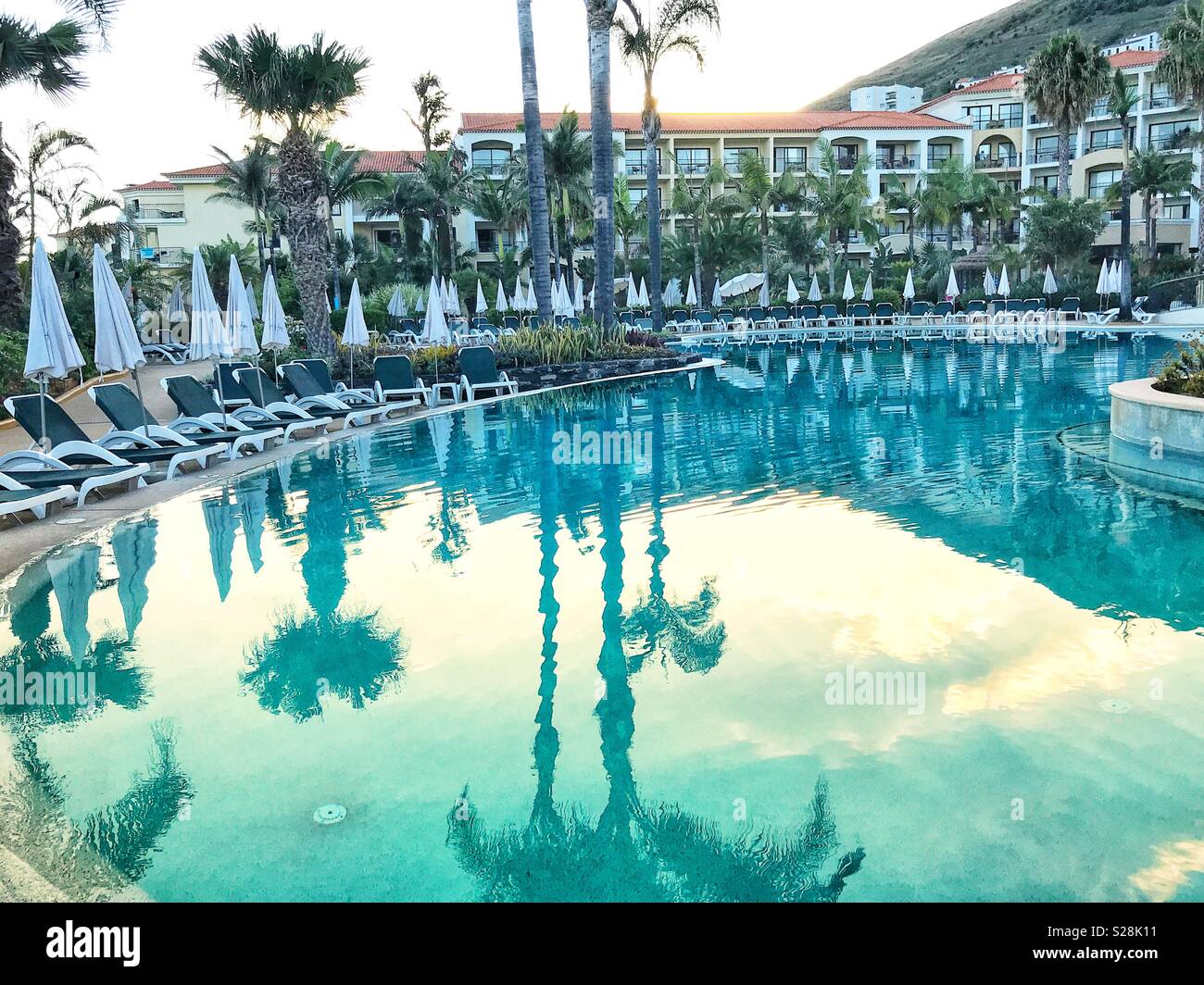 Hotel swimming pool and reflections in the evening - Smartphone Captured Stock Image