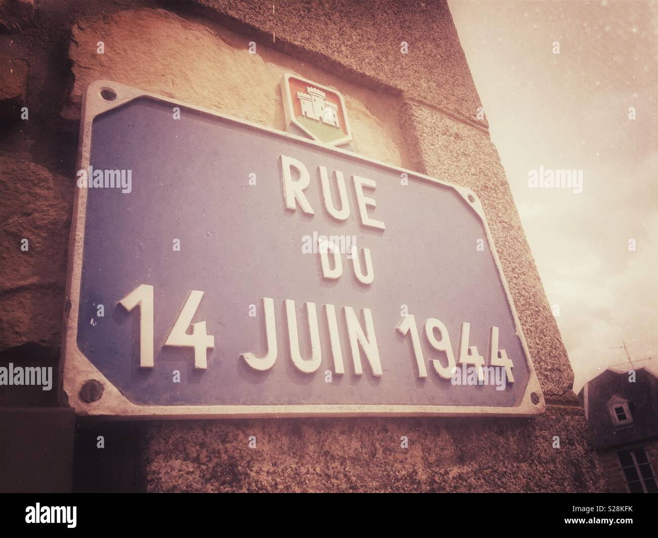 Road sign in the French village of Domfront, Normandy, commemorating the liberation of the village by the allies. - Smartphone Captured Stock Image