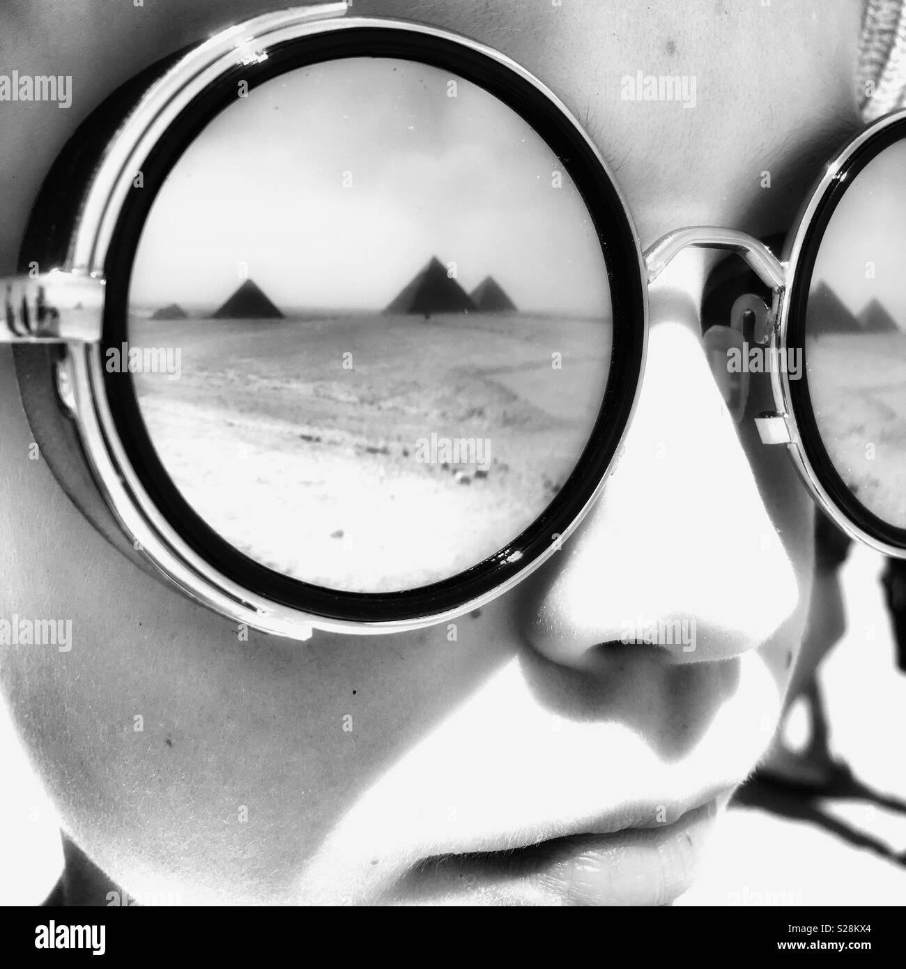 Pyramids reflected in boys mirror sunglasses Stock Photo