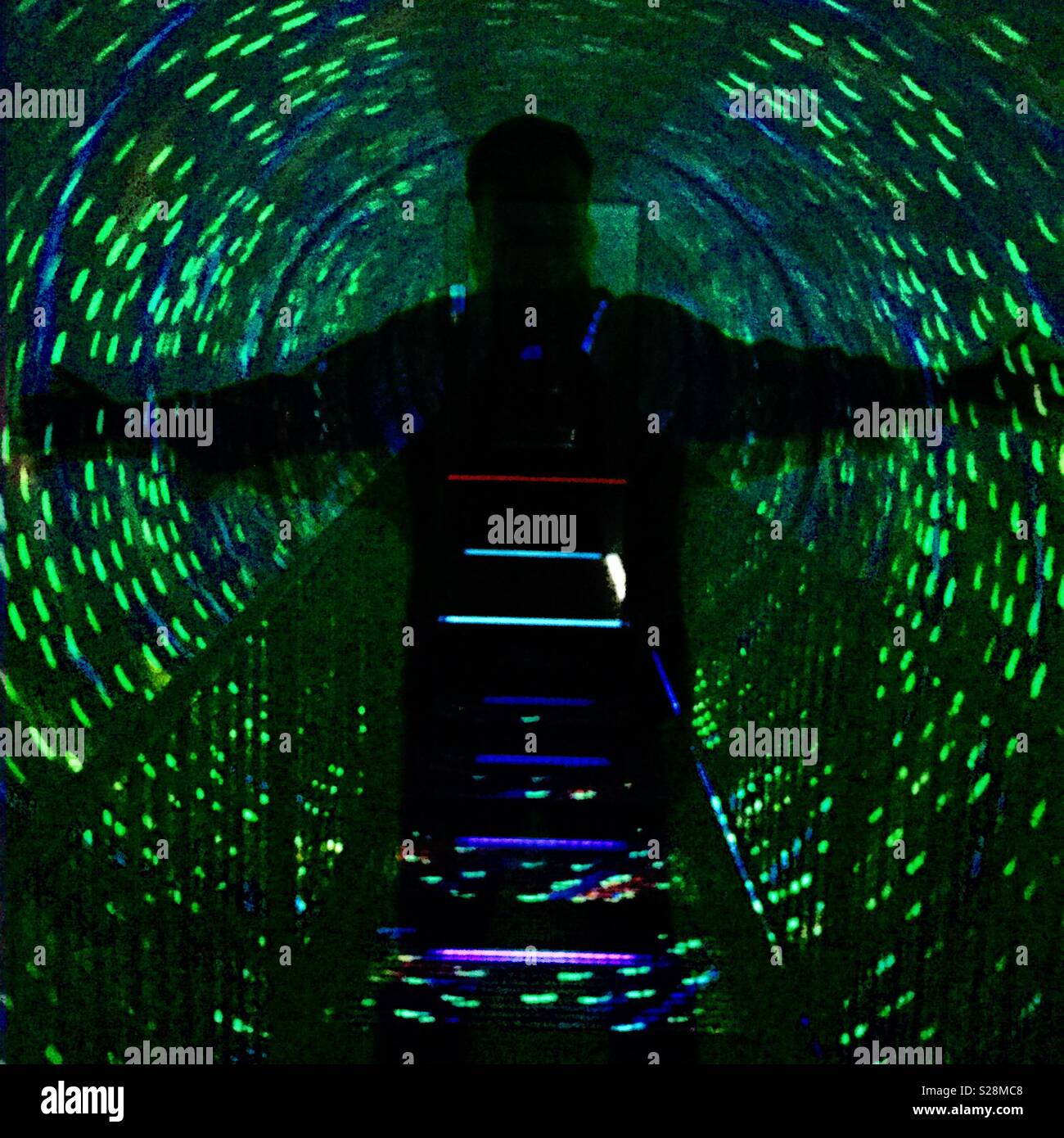 Silhouette of a man in a vortex of light - Smartphone Captured Stock Image