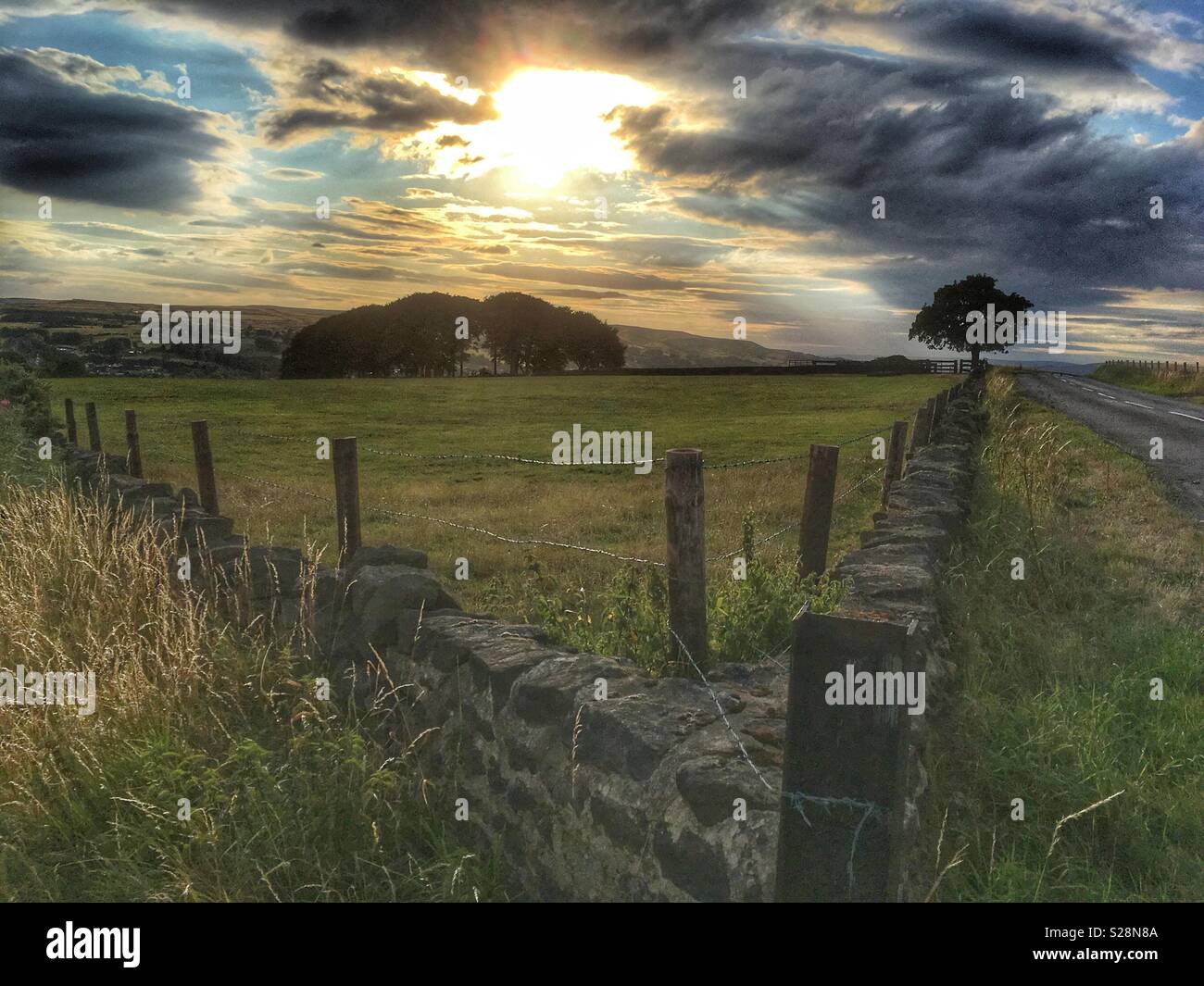 Late evening sun over Ilkley Moor from Guiseley Moor - Smartphone Captured Stock Image
