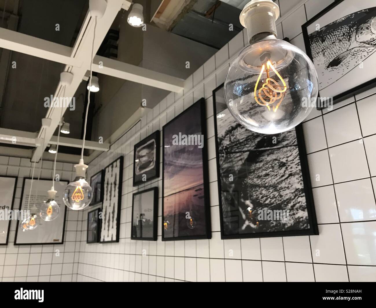 Pictures and bulbs holding in a room - Smartphone Captured Stock Image