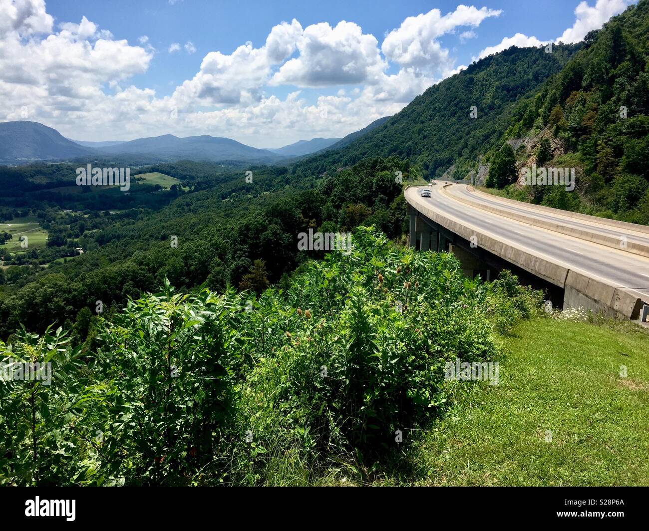 Big Stone Gap, Virginia, USA - July 23, 2018: Tourists travel along the Orby Cantrell Highway overlooking the Powell Valley in rural Southwest Virginia near the Kentucky border on a summer afternoon. Stock Photo