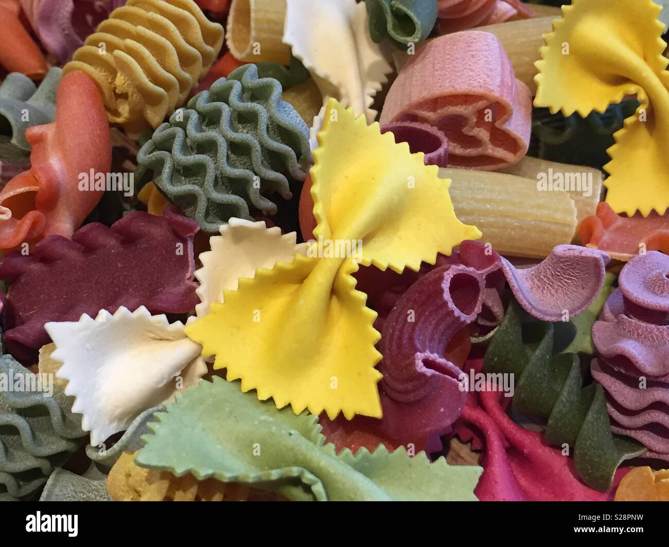 Multi coloured pasta shapes Stock Photo