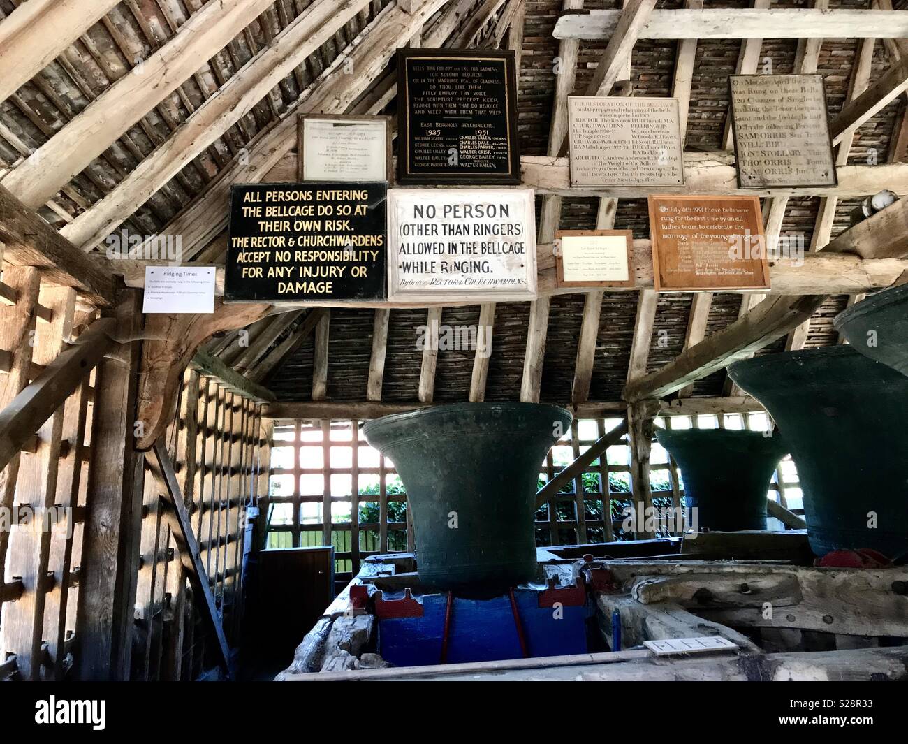 A ‘bell cage’ used in lieu of a bell tower in a church in FLATFORD, Suffolk, UK - Smartphone Captured Stock Image
