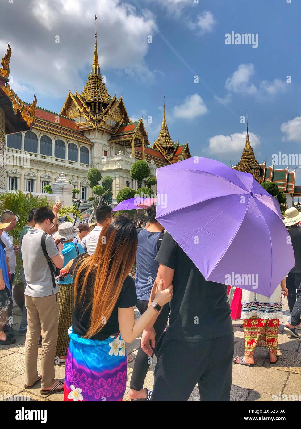 Crowds of tourists at a Buddhist temple in Bangkok, Thailand. - Smartphone Captured Stock Image