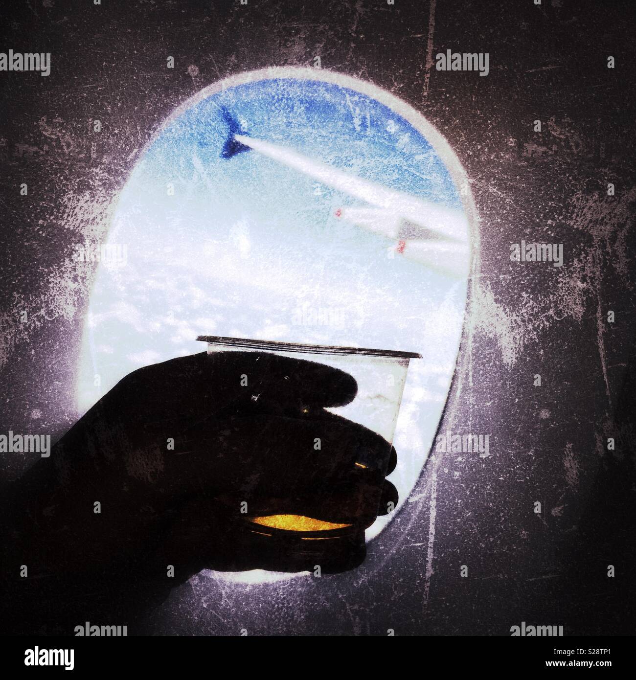 Drinking alcohol whilst flying in an aircraft - Smartphone Captured Stock Image Drinking alcohol whilst flying in an aircraft - Smartphone Captured Stock Image