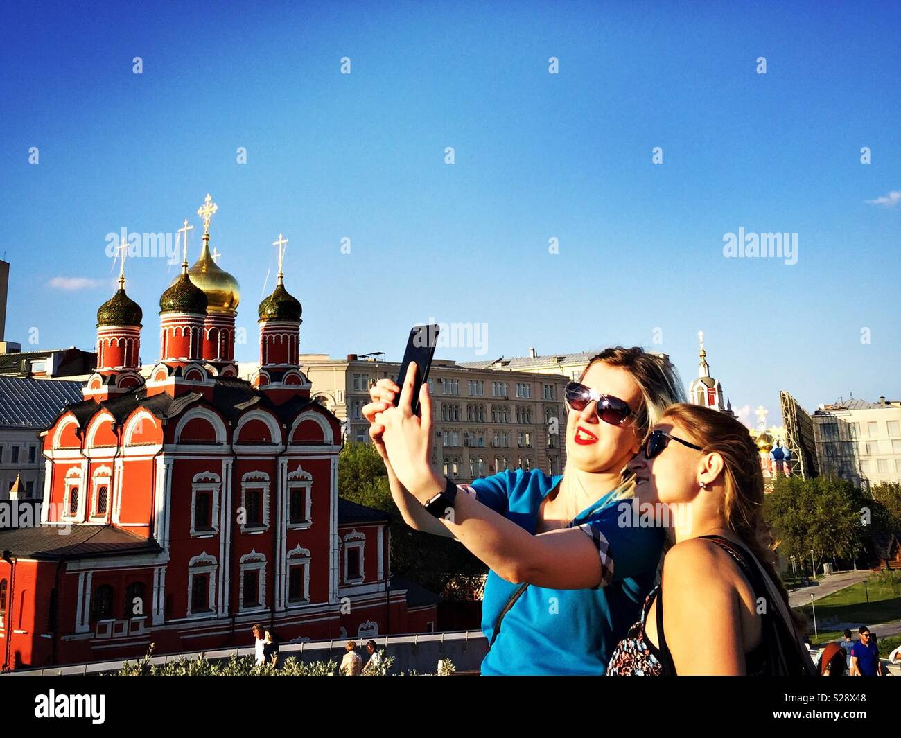 Two girls pose for a selfie Photograph in Moscow, Russia. Stock Photo