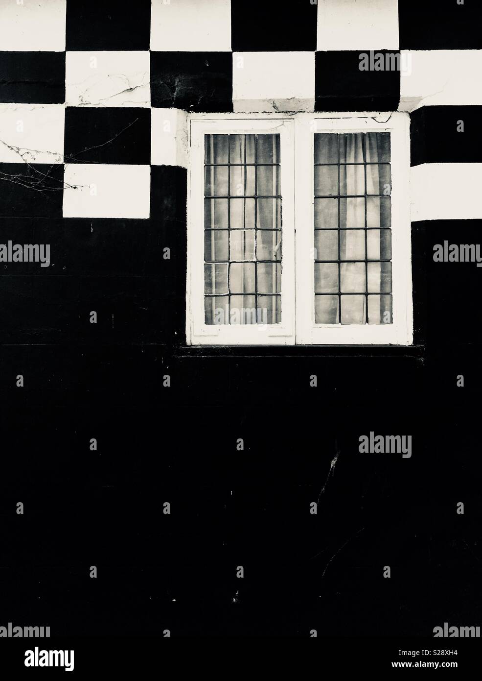 Black and White House with a leaded light window - Smartphone Captured Stock Image