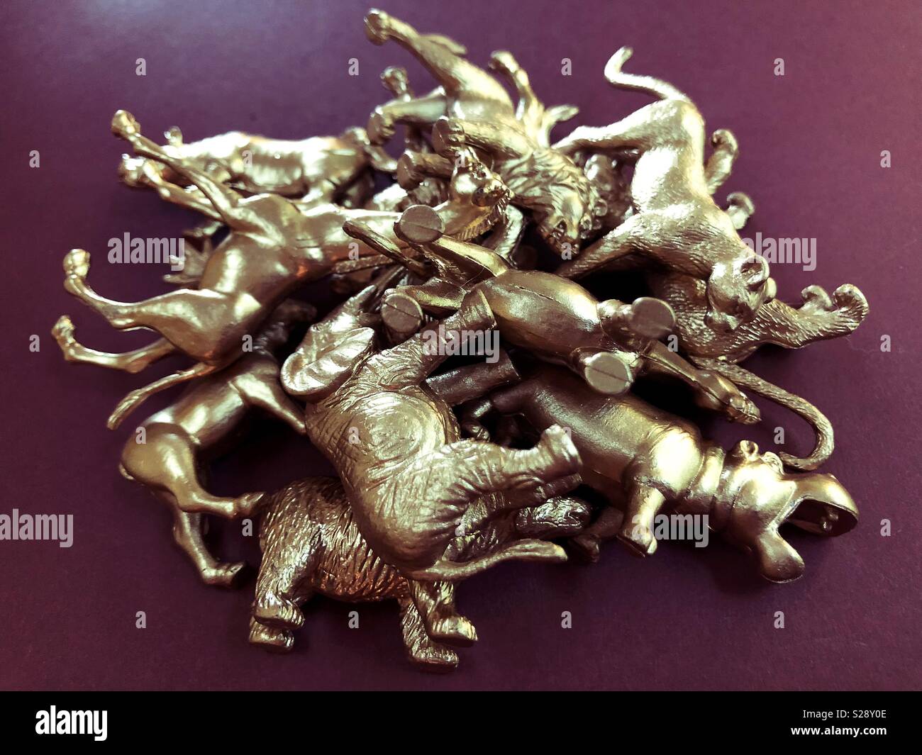 A pile of gold wild animal figurines Stock Photo - Alamy