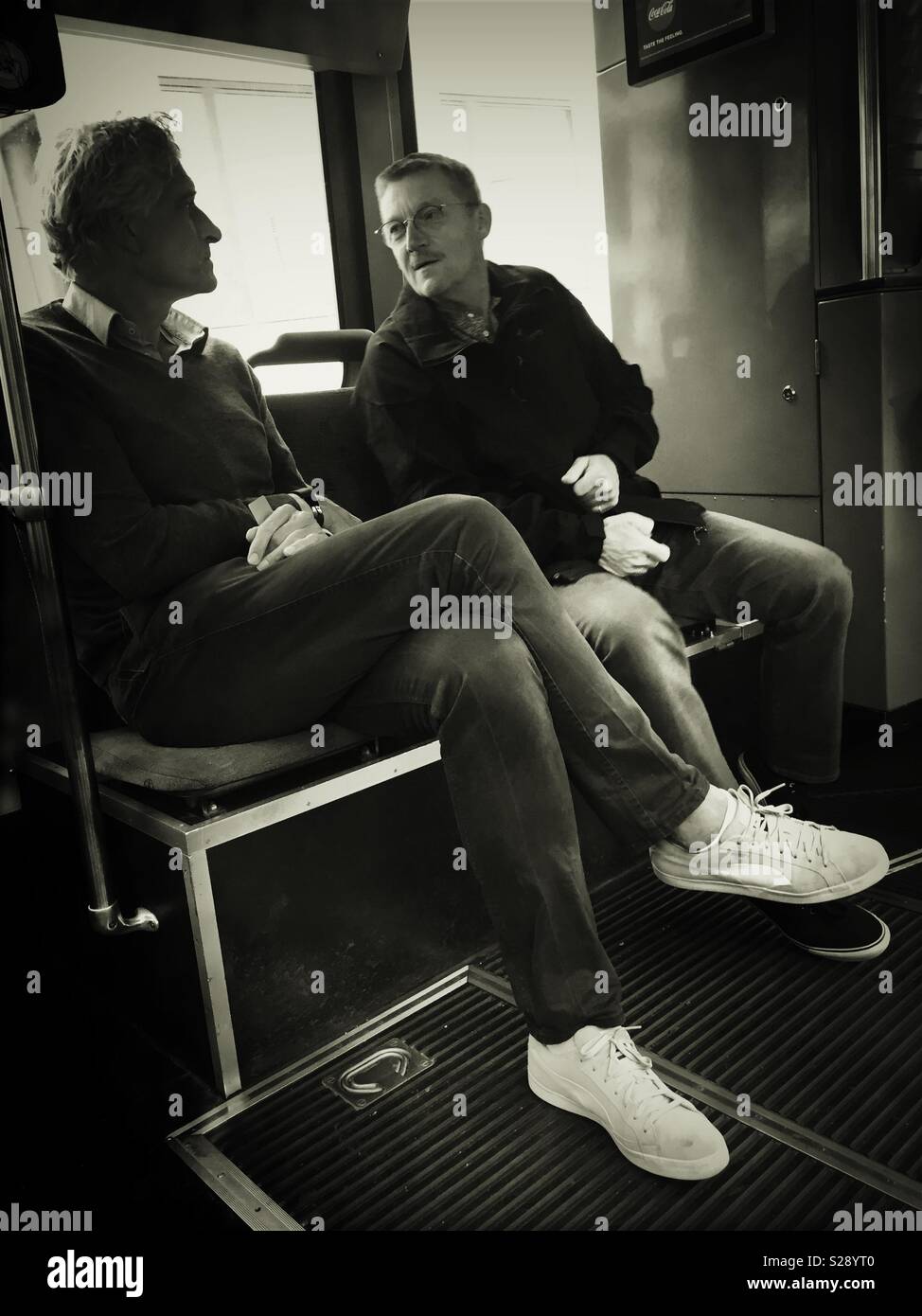 Discussion at Tram - Smartphone Captured Stock Image