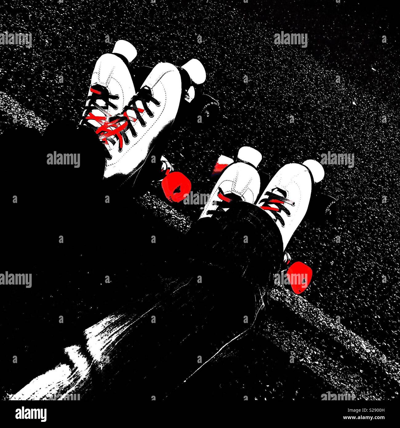 Twin roller skates taking a break after a roller session Stock Photo