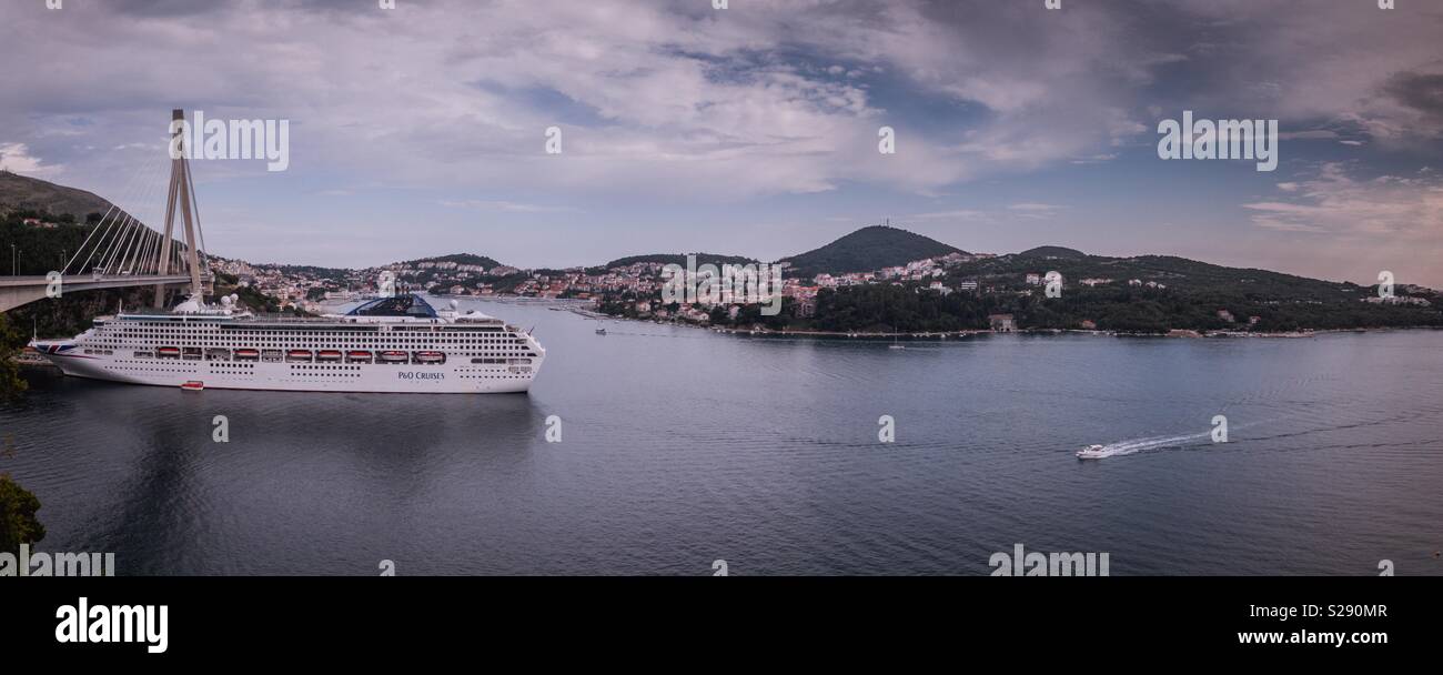 Panorama of entrance in Dubrovnik, Croatia with moored cruise ship Stock Photo