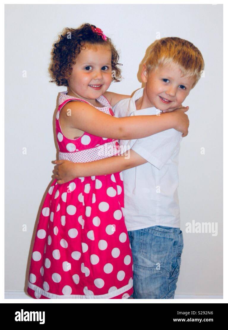 Boy Girl Twins Cuddling Each Other Stock Photo Alamy
