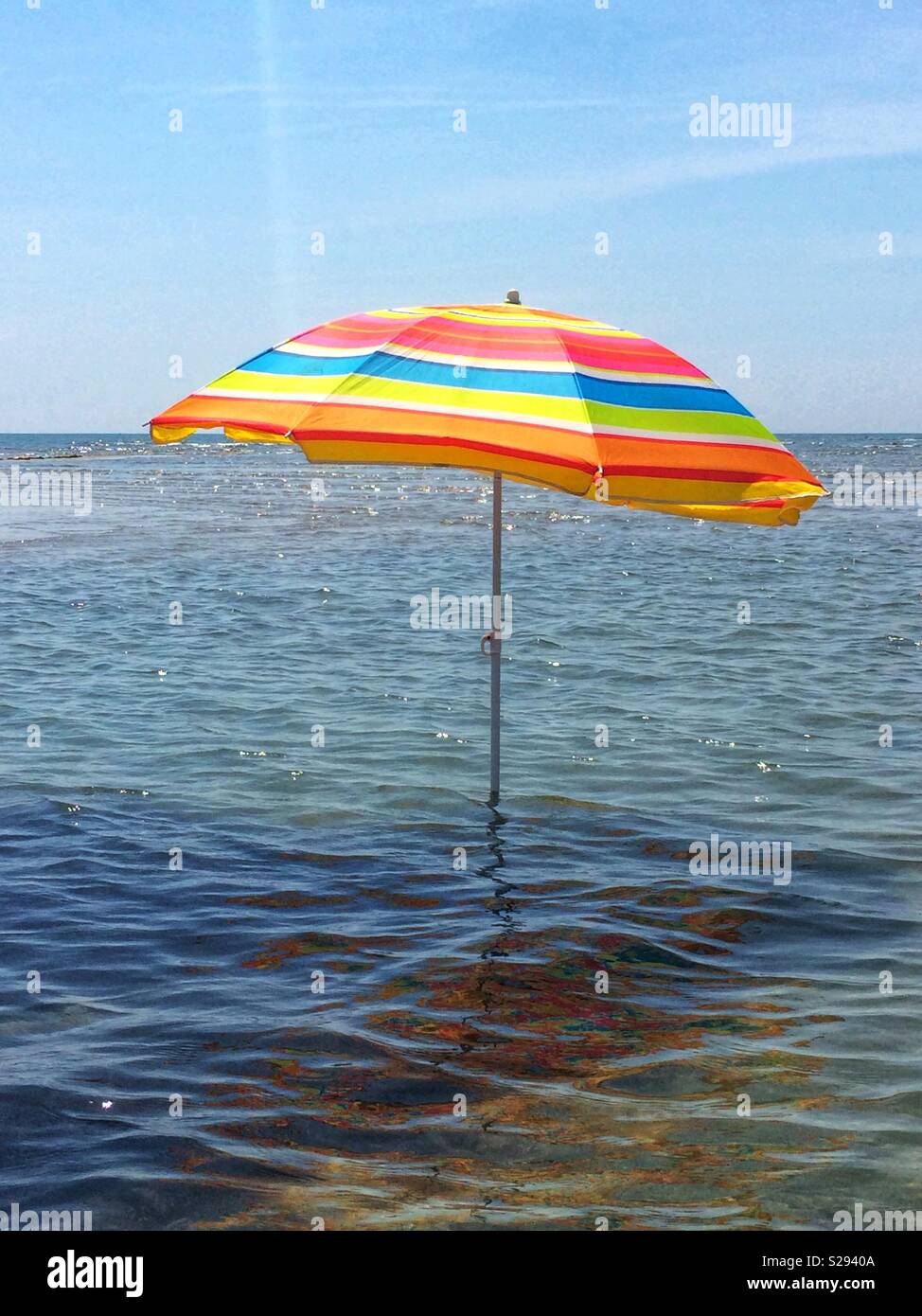 Umbrella in the shallow waters. - Smartphone Captured Stock Image