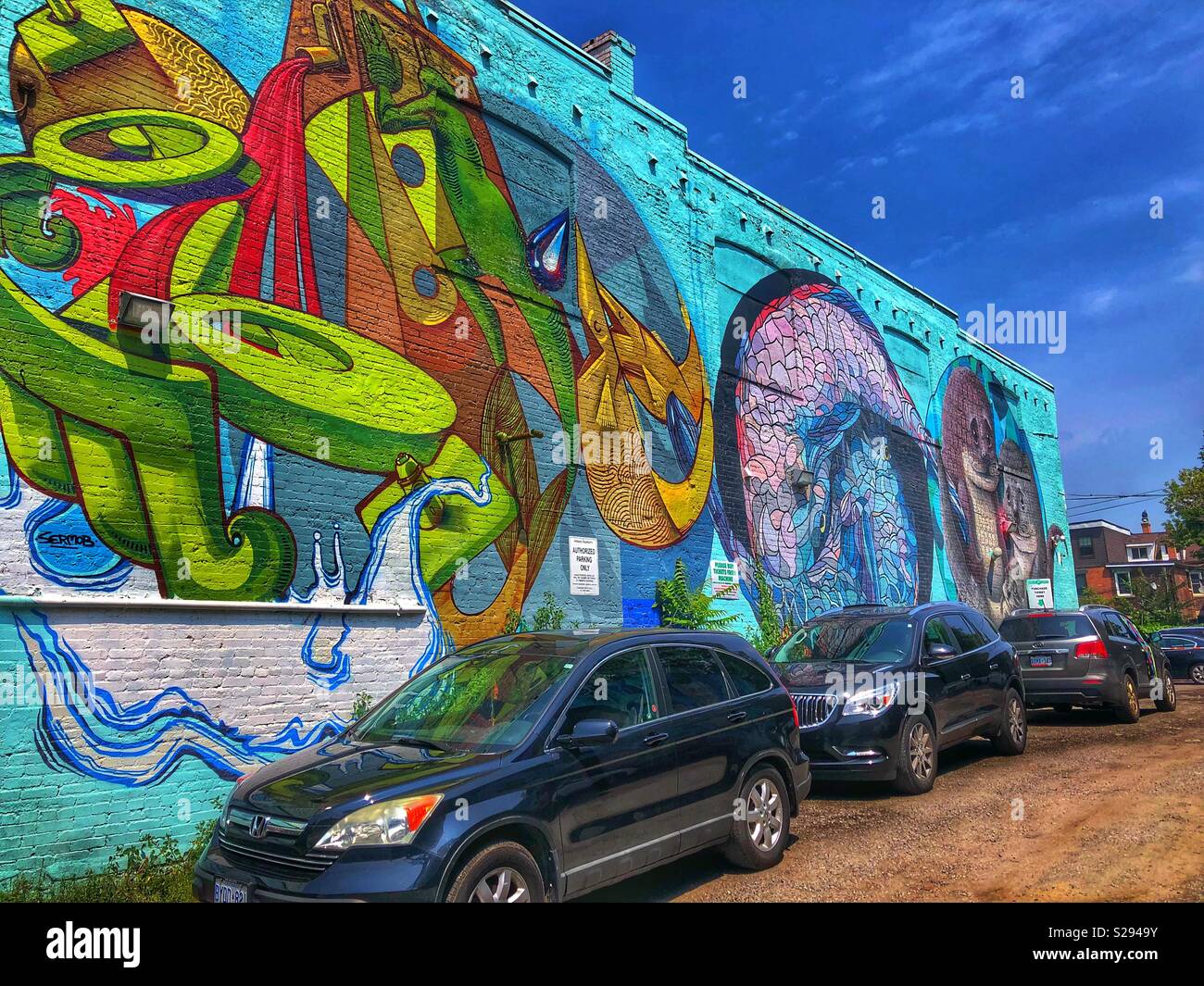Colourful graffiti mural in a Toronto neighbourhood. - Smartphone Captured Stock Image