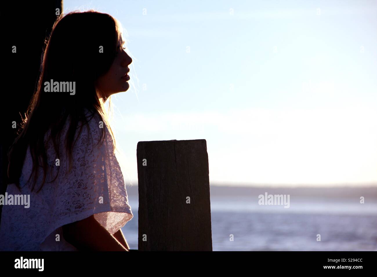 Young girl enjoying the sunset in Denmark Stock Photo