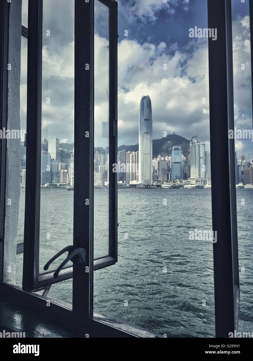 View at a skyline of Hong Kong island through an open window - Smartphone Captured Stock Image