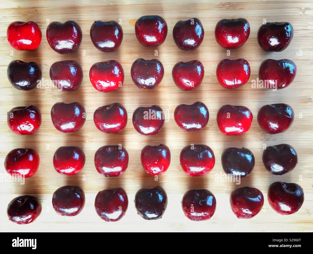 Picota cherries, a stalkless variety from Jerte, Spain. Knolling, flatlay food photography - Smartphone Captured Stock Image