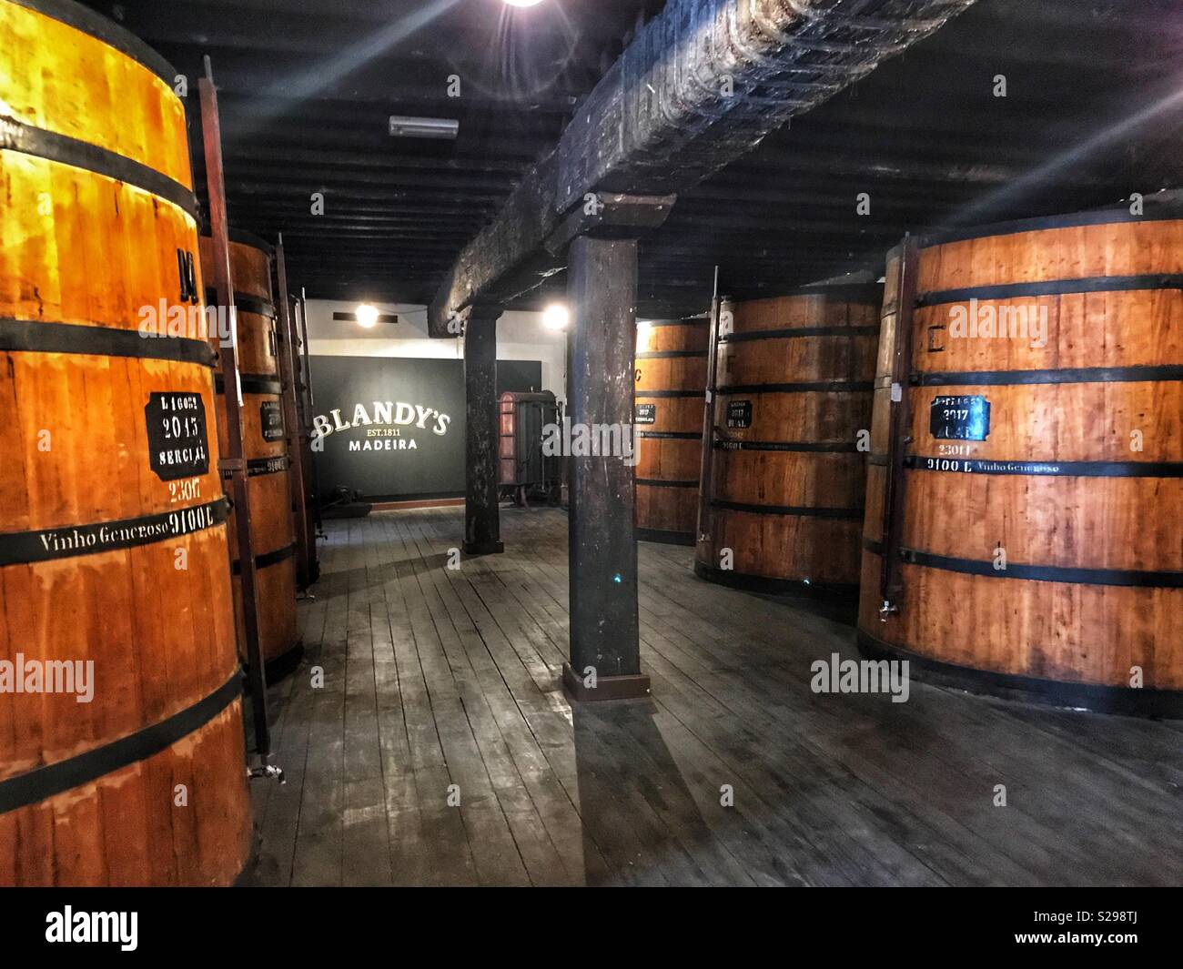 Blandy’s Wine Lodge Tour: Wine ageing in huge barrels, Blandy’s Wine Lodge, Funchal, Madeira, Portugal - Smartphone Captured Stock Image