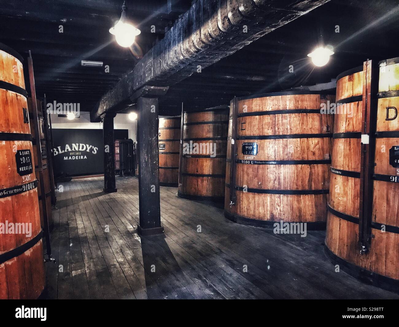 Blandy’ Wine Lodge Tour: Wine ageing in huge barrels, Blandy’s Wine Lodge, Funchal, Madeira, Portugal - Smartphone Captured Stock Image