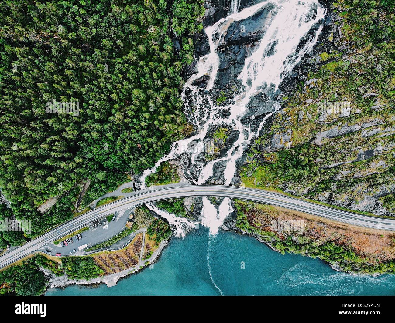 Laksforsen cascade in Grane municipality in Nordland Province in Norway  running over some 17 meter high cascades over a rocky stretch Stock Photo -  Alamy