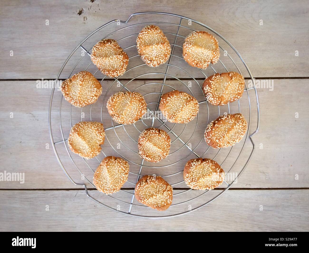 Tahini & sesame biscuits on a cooling rack - Smartphone Captured Stock Image