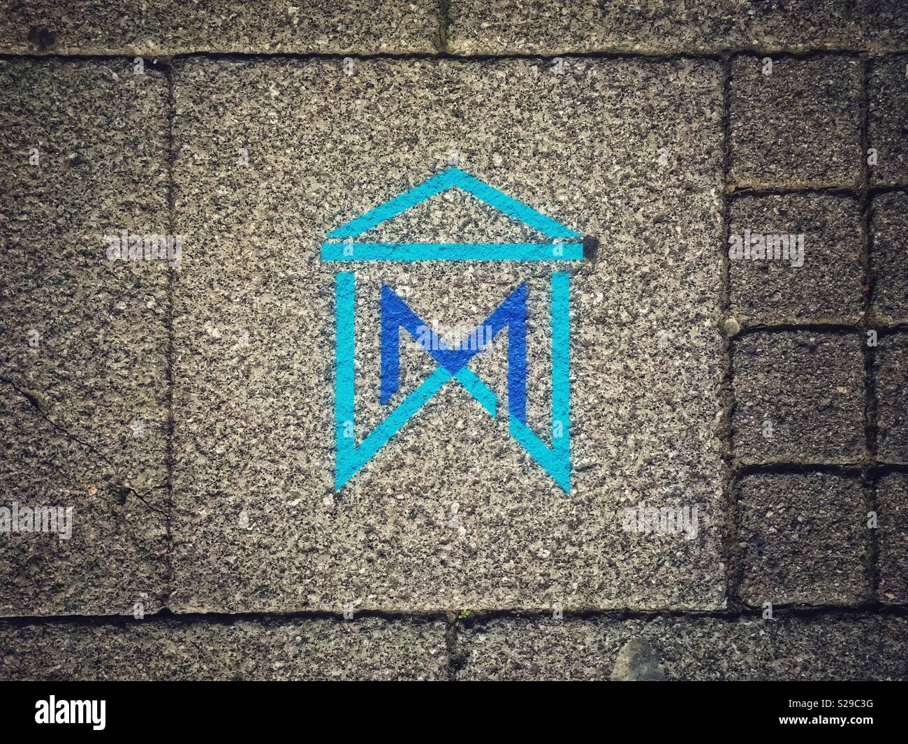 A sign painted on a pavement in WestonsuperMare, UK giving directions