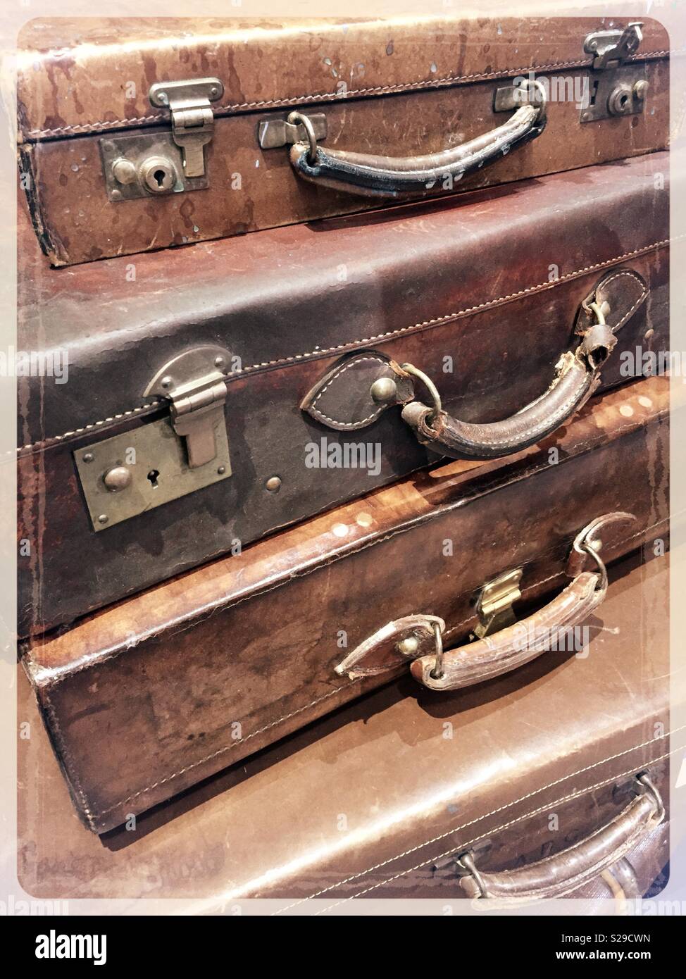 Vintage suitcases stacked together, United States. - Smartphone Captured Stock Image