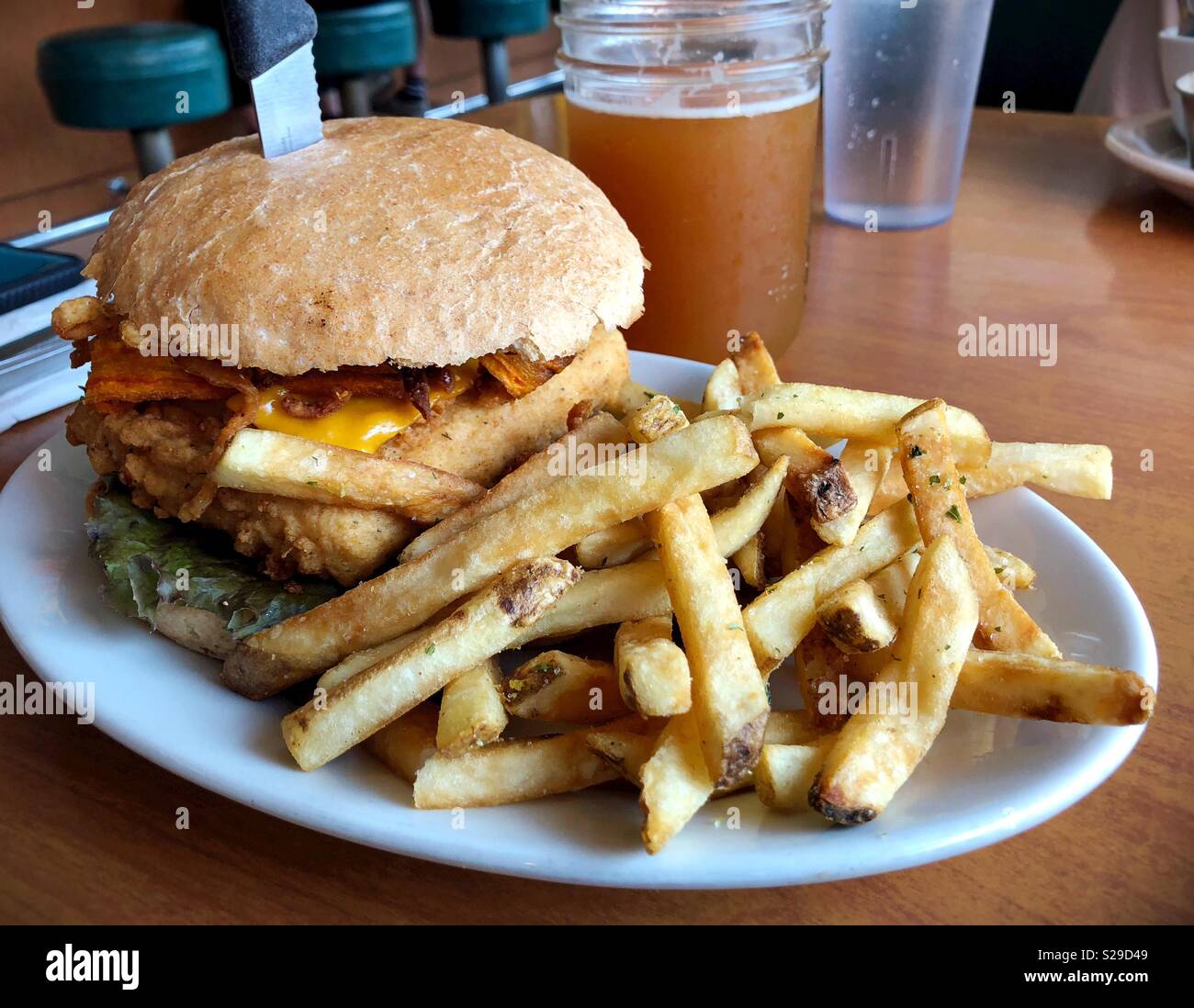 A vegan tofu burger and fries from Cornbread Cafe in Eugene, Oregon, USA. Stock Photo