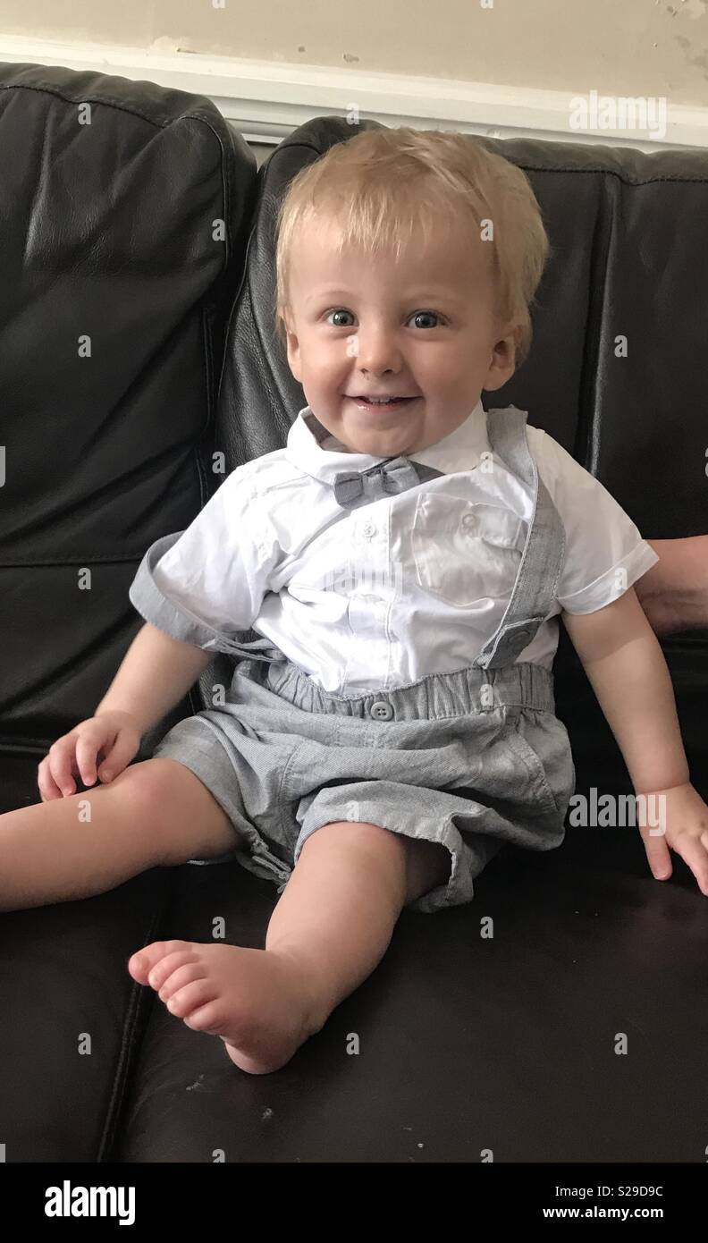 Boy dressed in bow tie & braces Stock Photo Alamy