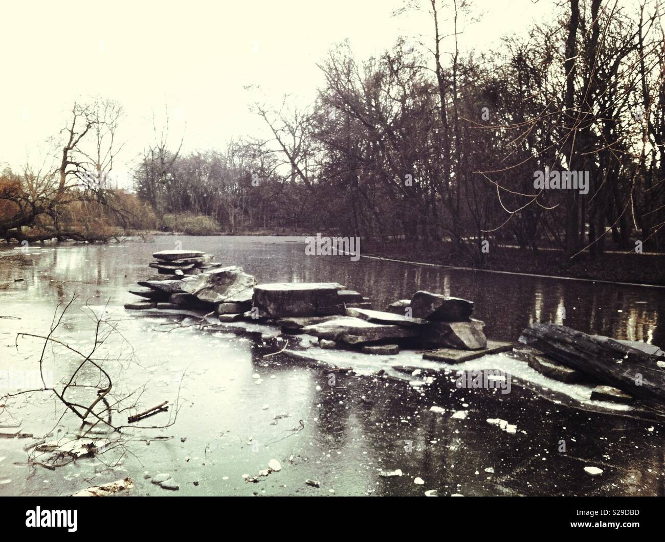 Frozen lake with natural stones fountain - Smartphone Captured Stock Image Frozen lake with natural stones fountain - Smartphone Captured Stock Image
