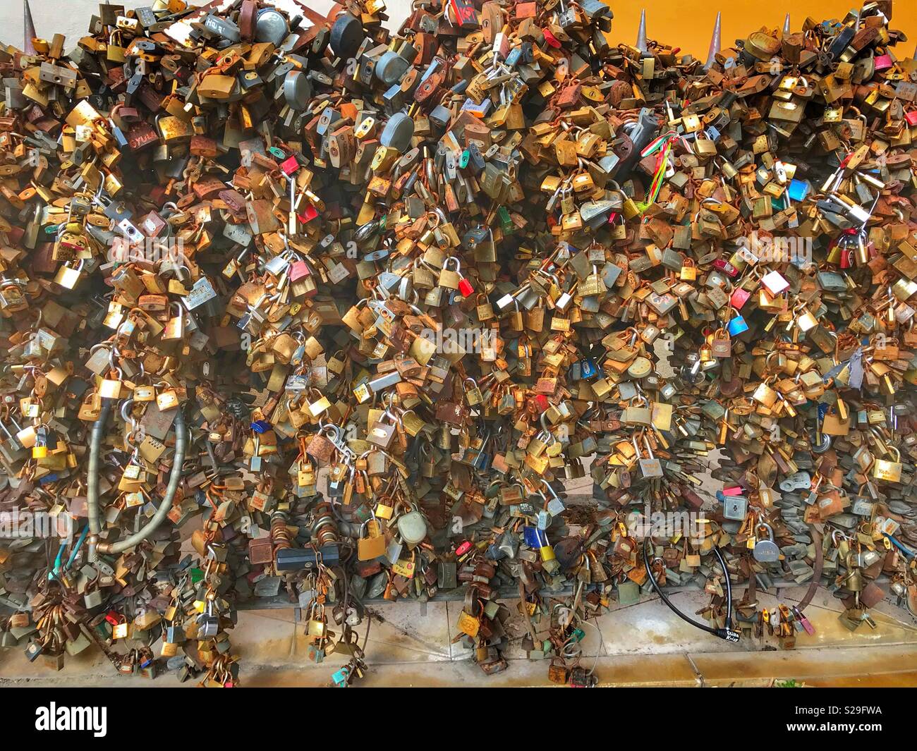 Tons of love locks all on the same fence - Smartphone Captured Stock Image